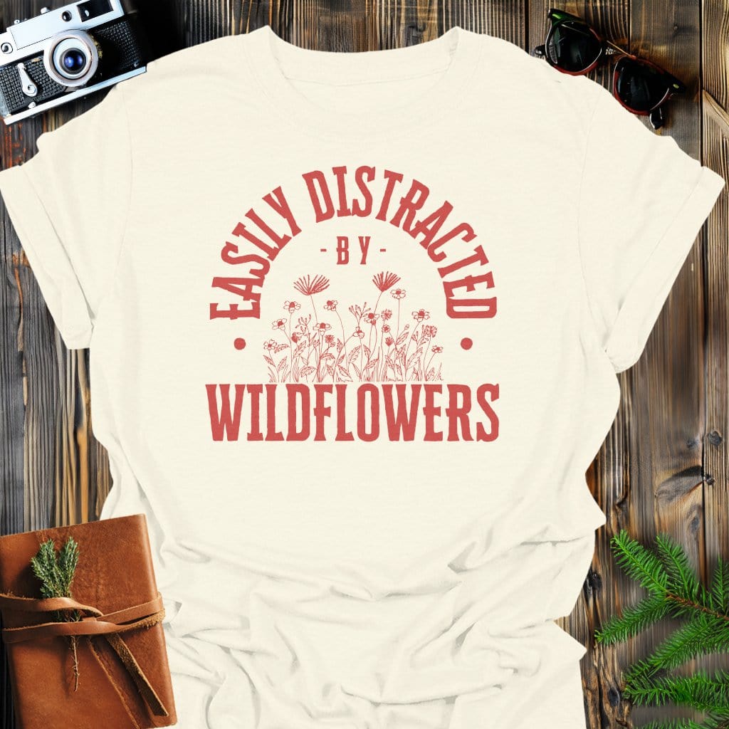 Distracted By Wildflowers T-Shirt In S / Natural Lightweight adventure tee for outdoor lovers Perfect for hiking camping or road trips Made from soft breathable cotton for all-day comfort Ideal for nature lovers and adventurers FAYO Threads outdoor apparel remember Fun Awaits You Outside
