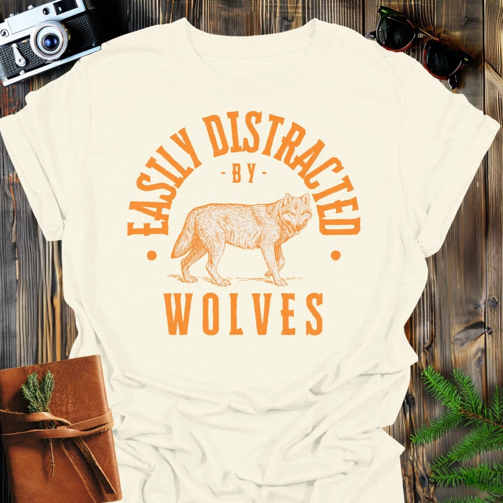 Distracted by Wolves T-Shirt In S / Natural Lightweight adventure tee for outdoor lovers Perfect for hiking camping or road trips Made from soft breathable cotton for all-day comfort Ideal for nature lovers and adventurers FAYO Threads outdoor apparel remember Fun Awaits You Outside