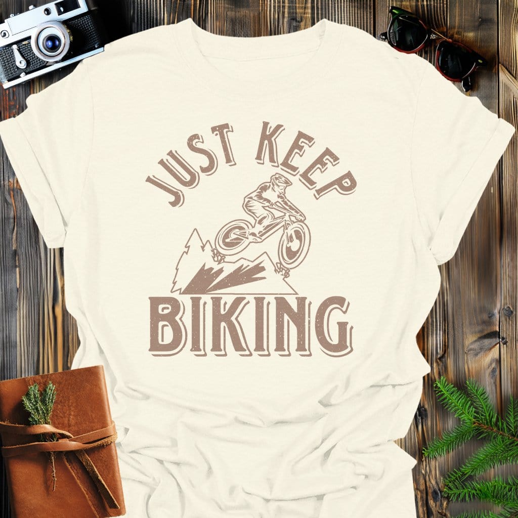 Just Keep Biking T-Shirt In Natural / S Lightweight adventure tee for outdoor lovers Perfect for hiking camping or road trips Made from soft breathable cotton for all-day comfort Ideal for nature lovers and adventurers FAYO Threads outdoor apparel remember Fun Awaits You Outside