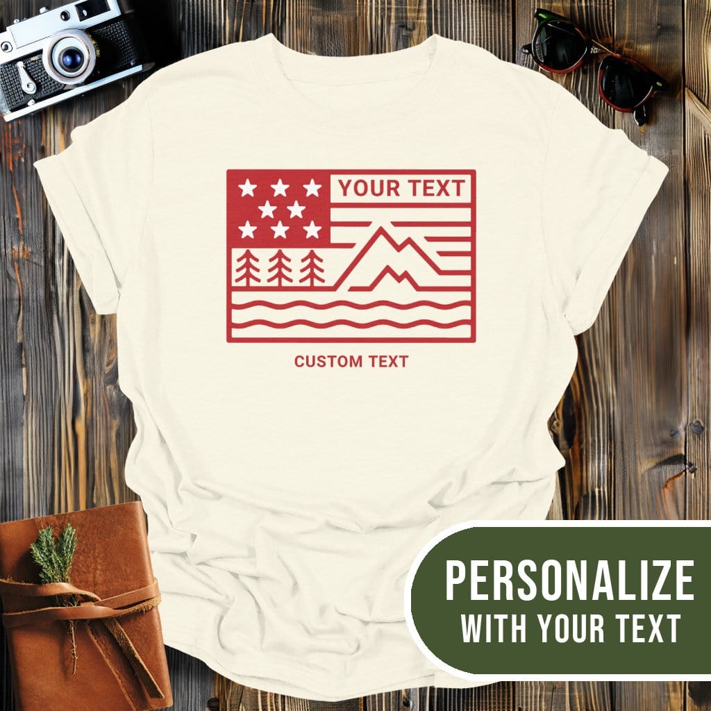 Personalized Mountain Flag T-Shirt In Natural / S Lightweight adventure tee for outdoor lovers Perfect for hiking camping or road trips Made from soft breathable cotton for all-day comfort Ideal for nature lovers and adventurers FAYO Threads outdoor apparel remember Fun Awaits You Outside