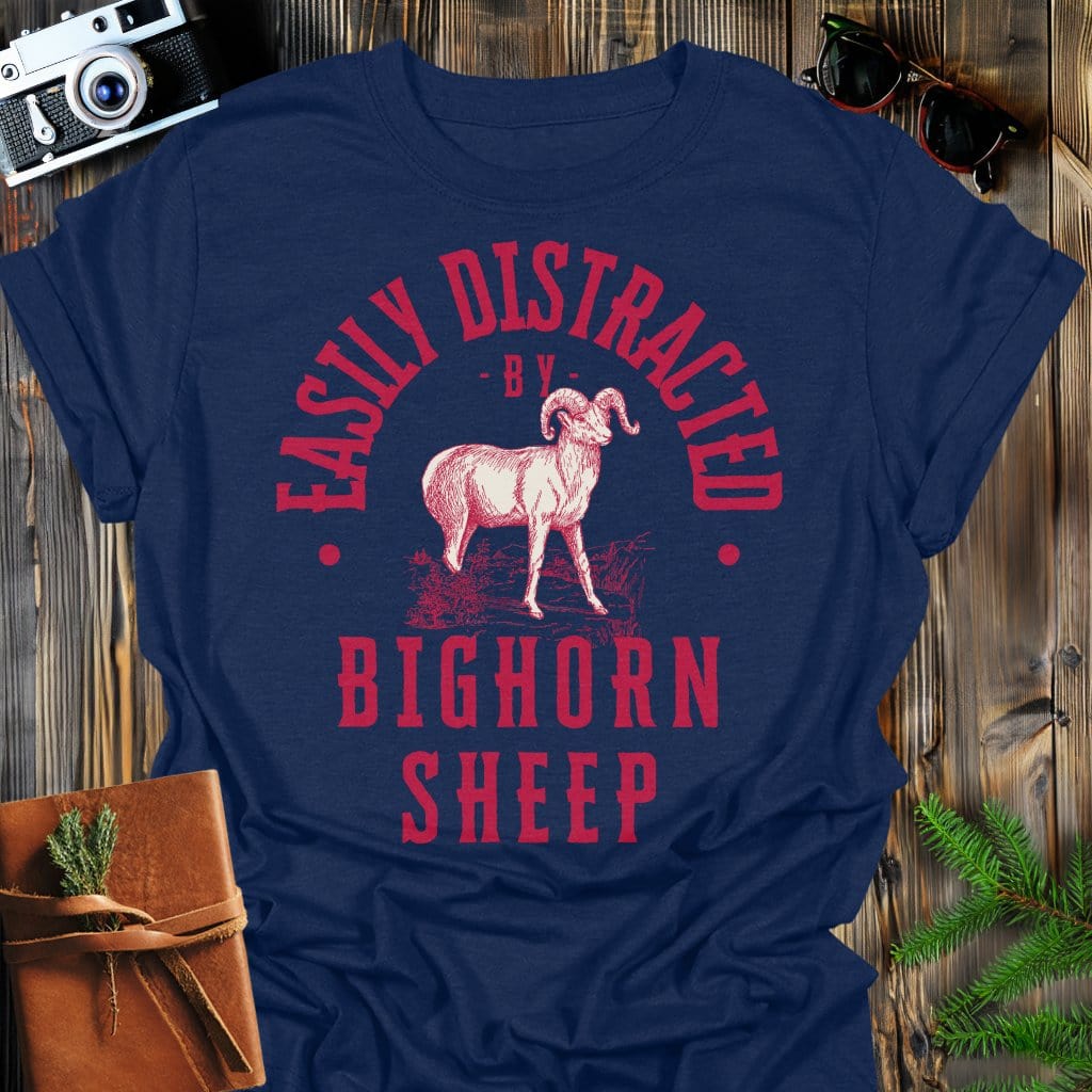 Distracted by Bighorn Sheep T-Shirt In S / Navy Lightweight adventure tee for outdoor lovers Perfect for hiking camping or road trips Made from soft breathable cotton for all-day comfort Ideal for nature lovers and adventurers FAYO Threads outdoor apparel remember Fun Awaits You Outside
