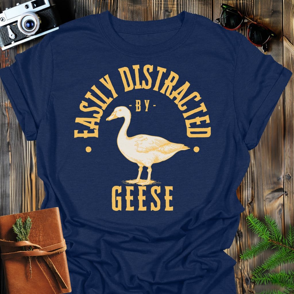 Distracted by Geese T-Shirt In S / Navy Lightweight adventure tee for outdoor lovers Perfect for hiking camping or road trips Made from soft breathable cotton for all-day comfort Ideal for nature lovers and adventurers FAYO Threads outdoor apparel remember Fun Awaits You Outside