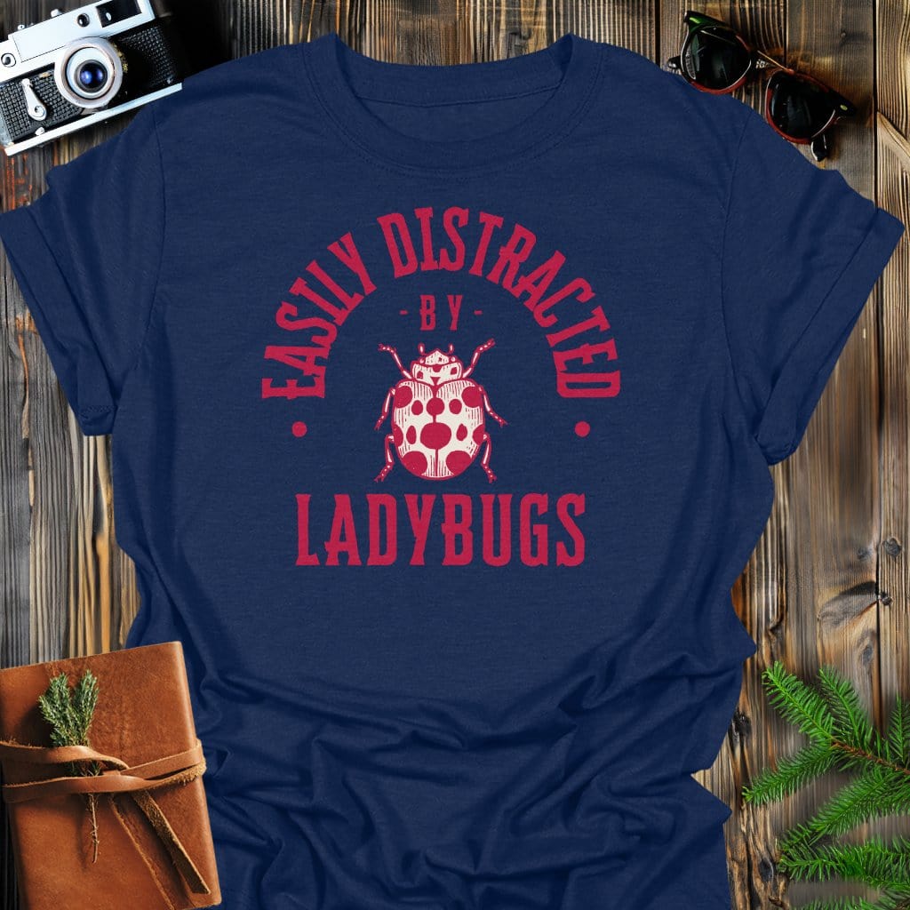 Distracted By Ladybugs T-Shirt In S / Navy Lightweight adventure tee for outdoor lovers Perfect for hiking camping or road trips Made from soft breathable cotton for all-day comfort Ideal for nature lovers and adventurers FAYO Threads outdoor apparel remember Fun Awaits You Outside