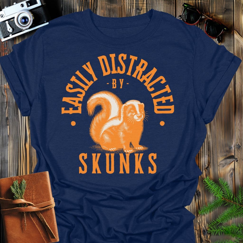 Distracted by Skunks T-Shirt In S / Navy Lightweight adventure tee for outdoor lovers Perfect for hiking camping or road trips Made from soft breathable cotton for all-day comfort Ideal for nature lovers and adventurers FAYO Threads outdoor apparel remember Fun Awaits You Outside