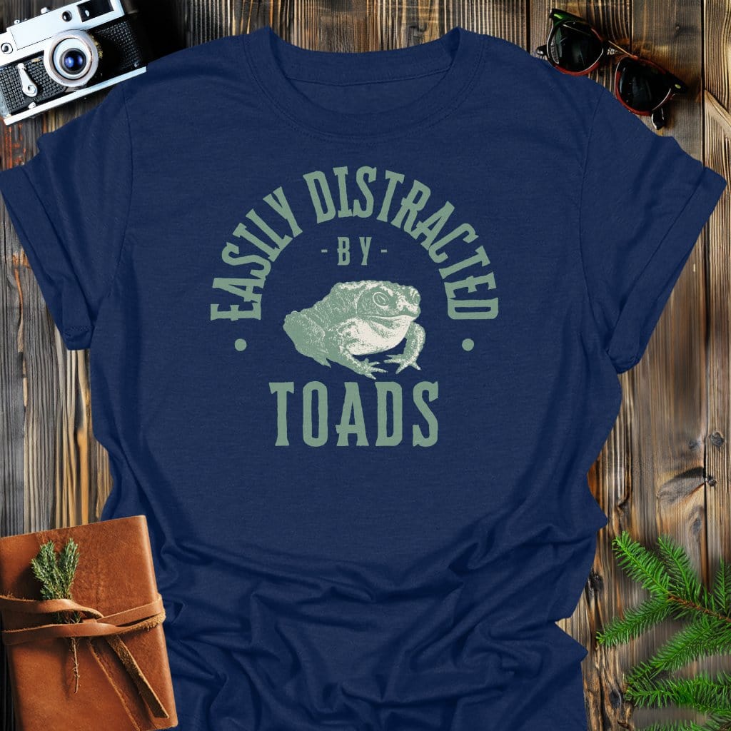 Distracted By Toads T-Shirt In S / Navy Lightweight adventure tee for outdoor lovers Perfect for hiking camping or road trips Made from soft breathable cotton for all-day comfort Ideal for nature lovers and adventurers FAYO Threads outdoor apparel remember Fun Awaits You Outside