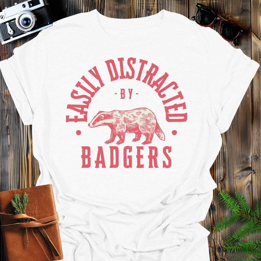 Distracted by Badgers T-Shirt In S / White Lightweight adventure tee for outdoor lovers Perfect for hiking camping or road trips Made from soft breathable cotton for all-day comfort Ideal for nature lovers and adventurers FAYO Threads outdoor apparel remember Fun Awaits You Outside