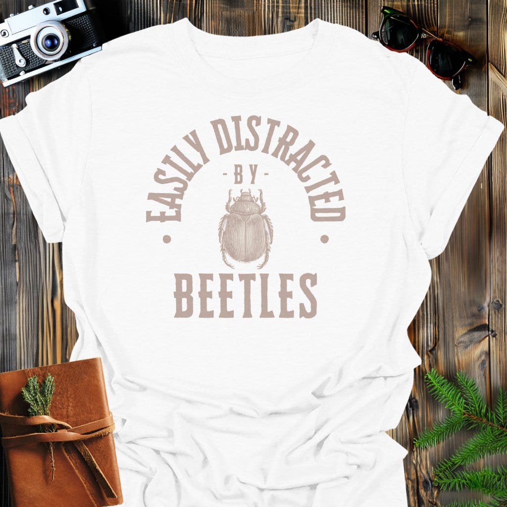 Distracted By Beetles T-Shirt In S / White Lightweight adventure tee for outdoor lovers Perfect for hiking camping or road trips Made from soft breathable cotton for all-day comfort Ideal for nature lovers and adventurers FAYO Threads outdoor apparel remember Fun Awaits You Outside