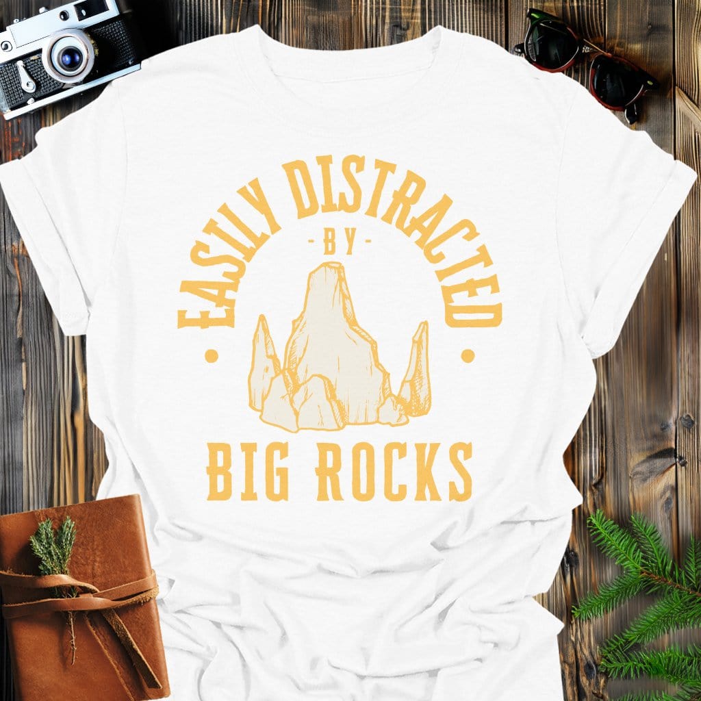 Distracted by Big Rocks T-Shirt In S / White Lightweight adventure tee for outdoor lovers Perfect for hiking camping or road trips Made from soft breathable cotton for all-day comfort Ideal for nature lovers and adventurers FAYO Threads outdoor apparel remember Fun Awaits You Outside
