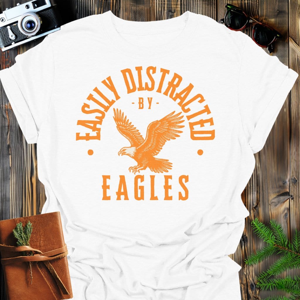 Distracted by Eagles T-Shirt In S / White Lightweight adventure tee for outdoor lovers Perfect for hiking camping or road trips Made from soft breathable cotton for all-day comfort Ideal for nature lovers and adventurers FAYO Threads outdoor apparel remember Fun Awaits You Outside