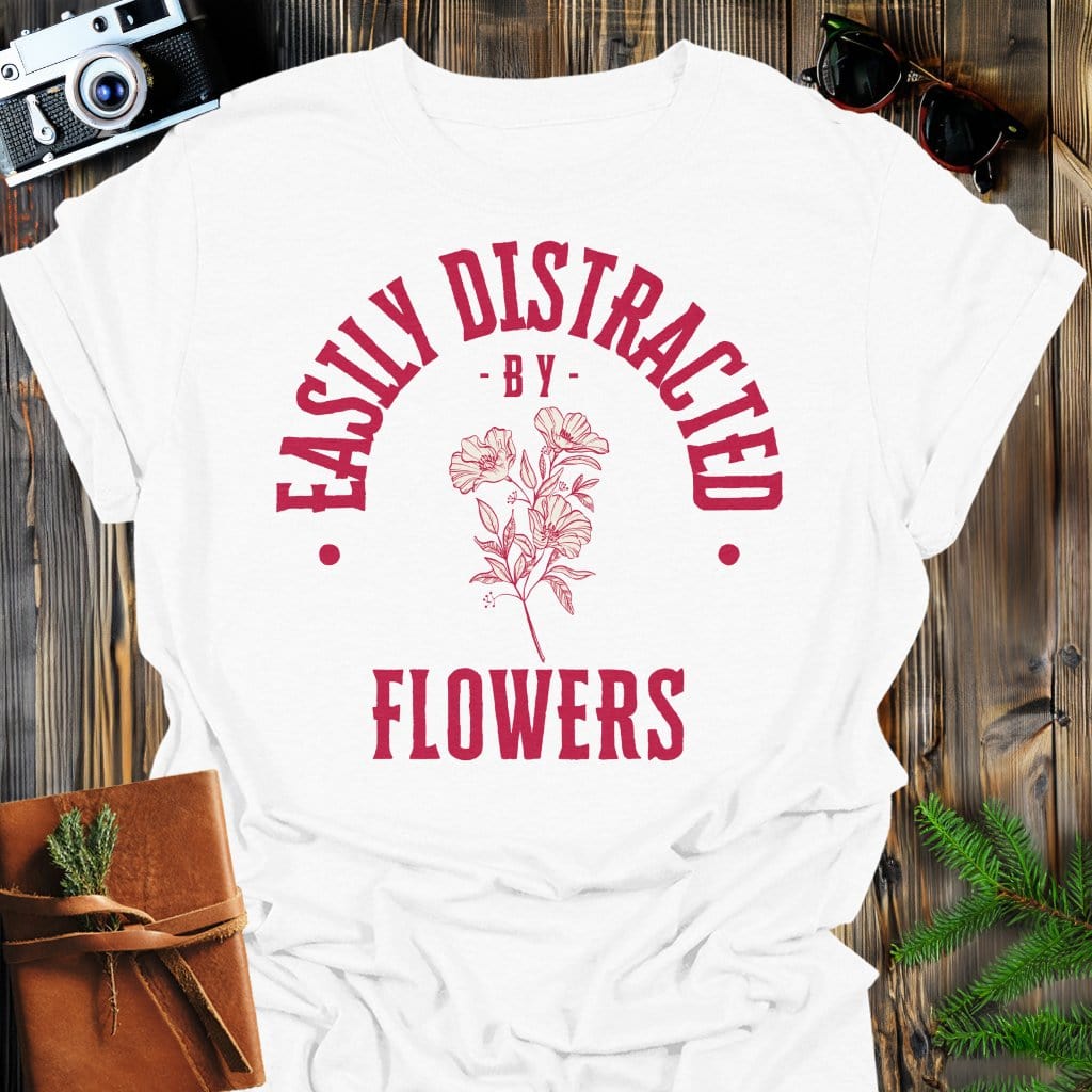 Distracted by Flowers T-Shirt In S / White Lightweight adventure tee for outdoor lovers Perfect for hiking camping or road trips Made from soft breathable cotton for all-day comfort Ideal for nature lovers and adventurers FAYO Threads outdoor apparel remember Fun Awaits You Outside