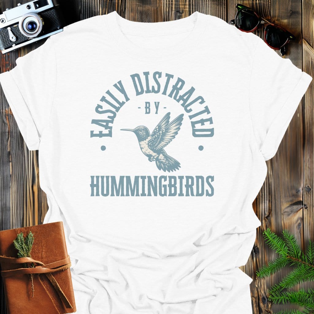 Distracted By Hummingbirds T-Shirt In S / White Lightweight adventure tee for outdoor lovers Perfect for hiking camping or road trips Made from soft breathable cotton for all-day comfort Ideal for nature lovers and adventurers FAYO Threads outdoor apparel remember Fun Awaits You Outside