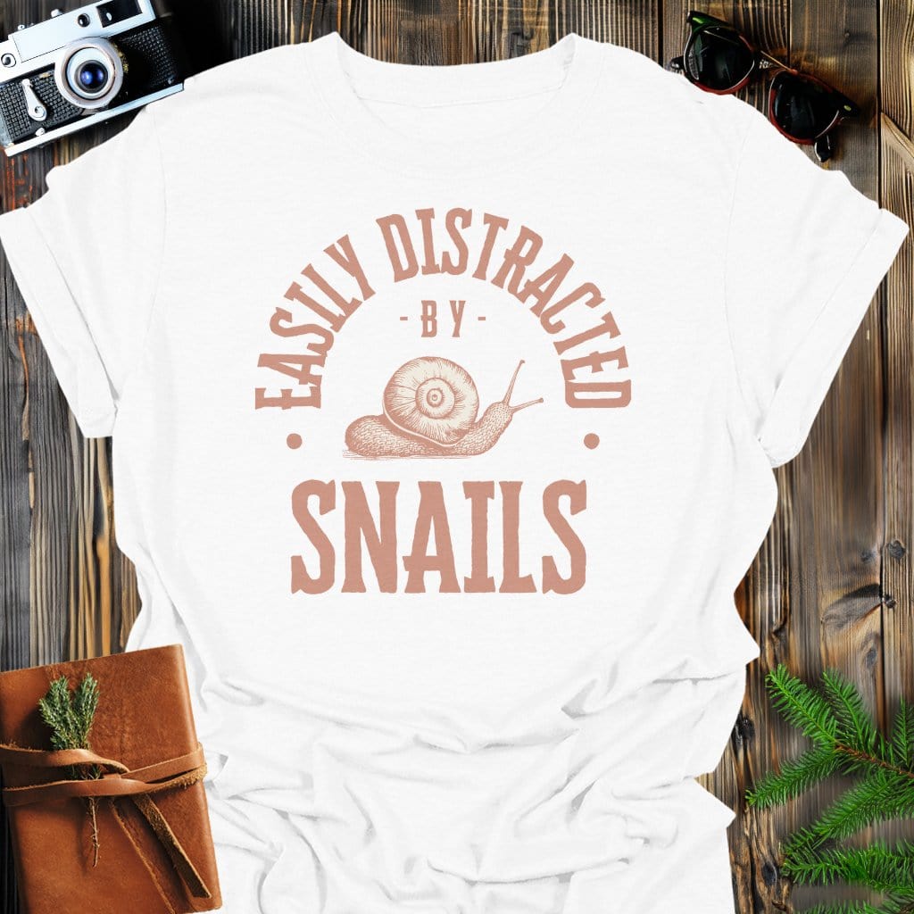 Distracted By Snails T-Shirt In S / White Lightweight adventure tee for outdoor lovers Perfect for hiking camping or road trips Made from soft breathable cotton for all-day comfort Ideal for nature lovers and adventurers FAYO Threads outdoor apparel remember Fun Awaits You Outside