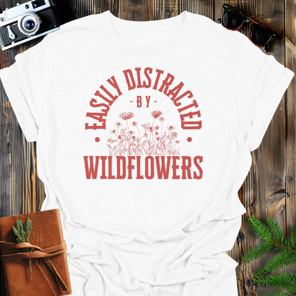 Distracted By Wildflowers T-Shirt In S / White Lightweight adventure tee for outdoor lovers Perfect for hiking camping or road trips Made from soft breathable cotton for all-day comfort Ideal for nature lovers and adventurers FAYO Threads outdoor apparel remember Fun Awaits You Outside