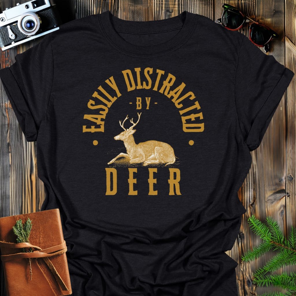 Distracted By Deer T-Shirt In Black / S Lightweight adventure tee for outdoor lovers Perfect for hiking camping or road trips Made from soft breathable cotton for all-day comfort Ideal for nature lovers and adventurers FAYO Threads outdoor apparel remember Fun Awaits You Outside