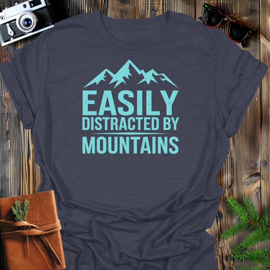 Easily Distracted By Mountains T-Shirt In Dark Heather / S Lightweight adventure tee for outdoor lovers Perfect for hiking camping or road trips Made from soft breathable cotton for all-day comfort Ideal for nature lovers and adventurers FAYO Threads outdoor apparel remember Fun Awaits You Outside