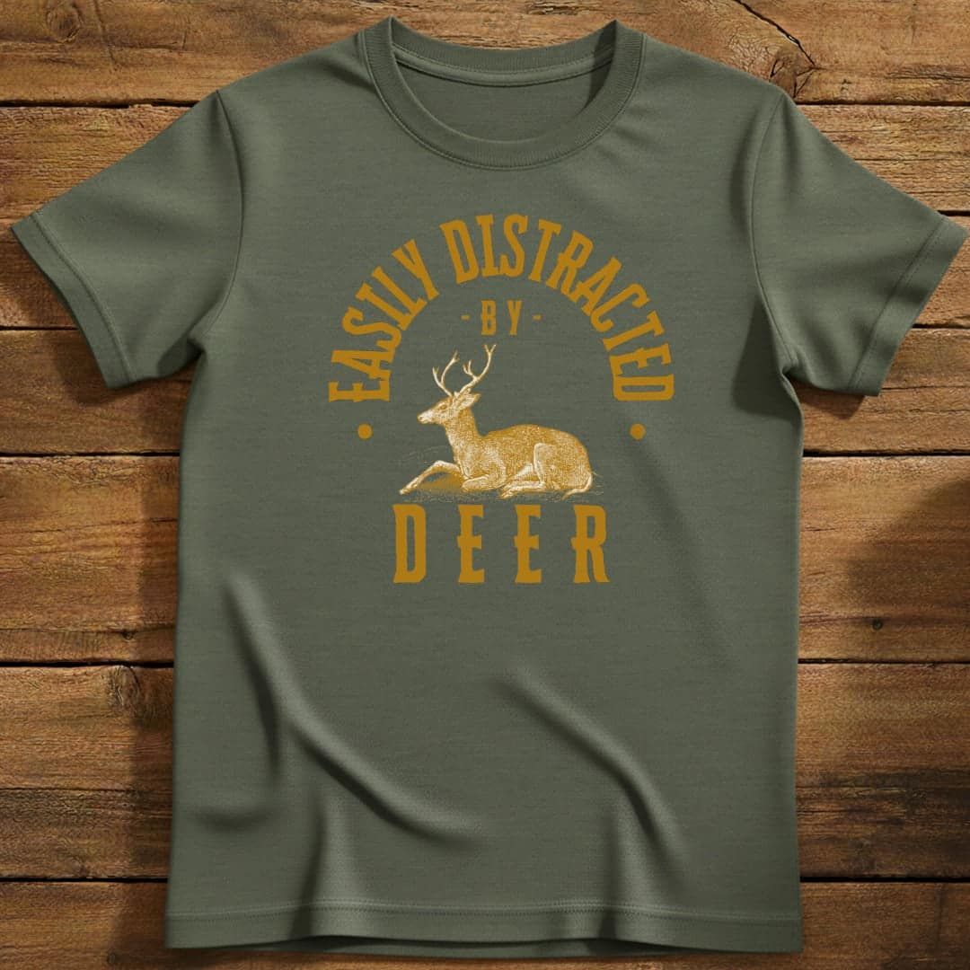 Distracted By Deer T-Shirt In Military Green / S Lightweight adventure tee for outdoor lovers Perfect for hiking camping or road trips Made from soft breathable cotton for all-day comfort Ideal for nature lovers and adventurers FAYO Threads outdoor apparel remember Fun Awaits You Outside