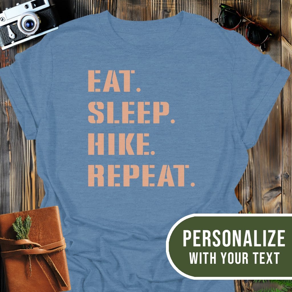 Personalized Hike Repeat T-Shirt In Heather Indigo / S Lightweight adventure tee for outdoor lovers Perfect for hiking camping or road trips Made from soft breathable cotton for all-day comfort Ideal for nature lovers and adventurers FAYO Threads outdoor apparel remember Fun Awaits You Outside