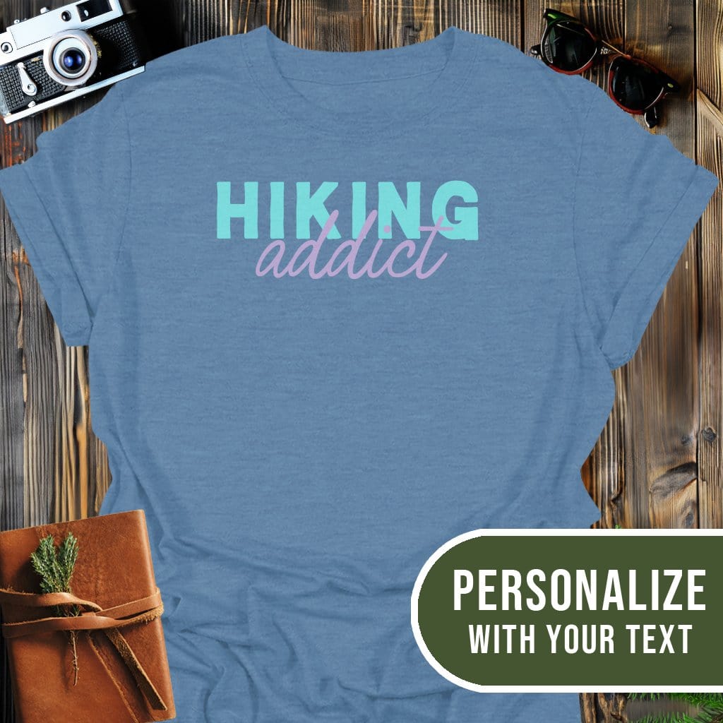 Personalized Hiking Addict T-Shirt In Heather Indigo / S Lightweight adventure tee for outdoor lovers Perfect for hiking camping or road trips Made from soft breathable cotton for all-day comfort Ideal for nature lovers and adventurers FAYO Threads outdoor apparel remember Fun Awaits You Outside