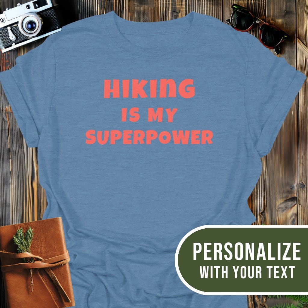 Personalized Hiking Superpower T-Shirt In Heather Indigo / S Lightweight adventure tee for outdoor lovers Perfect for hiking camping or road trips Made from soft breathable cotton for all-day comfort Ideal for nature lovers and adventurers FAYO Threads outdoor apparel remember Fun Awaits You Outside