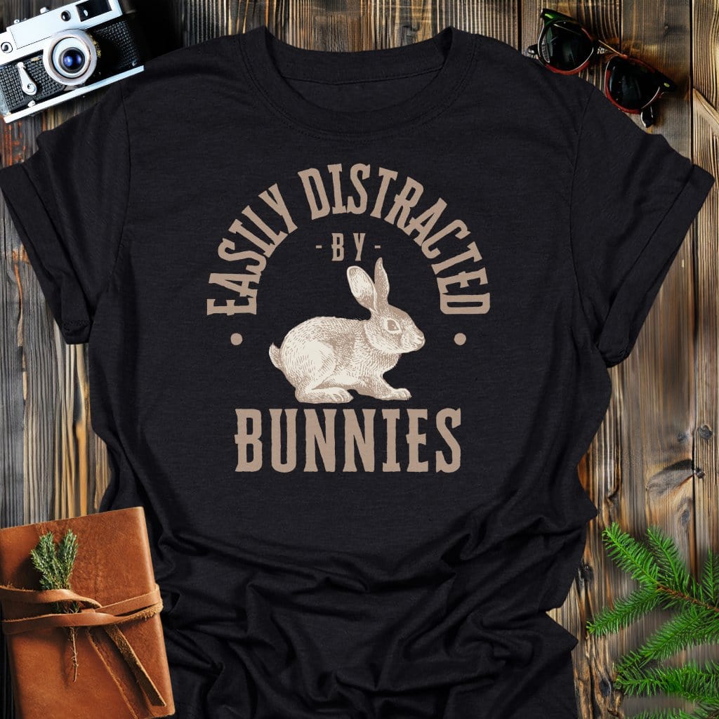 Distracted By Bunnies T-Shirt In S / Black Lightweight adventure tee for outdoor lovers Perfect for hiking camping or road trips Made from soft breathable cotton for all-day comfort Ideal for nature lovers and adventurers FAYO Threads outdoor apparel remember Fun Awaits You Outside