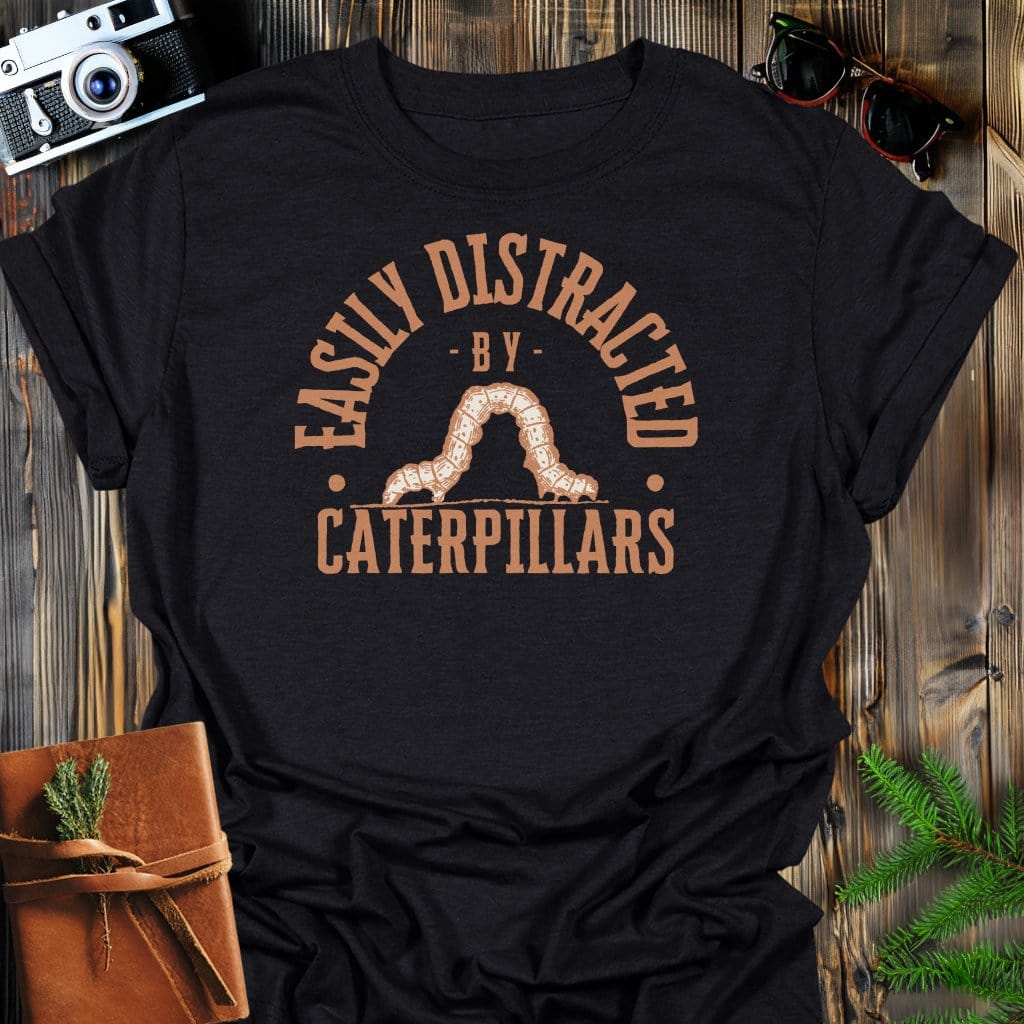 Distracted By Catepillars T-Shirt In S / Black Lightweight adventure tee for outdoor lovers Perfect for hiking camping or road trips Made from soft breathable cotton for all-day comfort Ideal for nature lovers and adventurers FAYO Threads outdoor apparel remember Fun Awaits You Outside