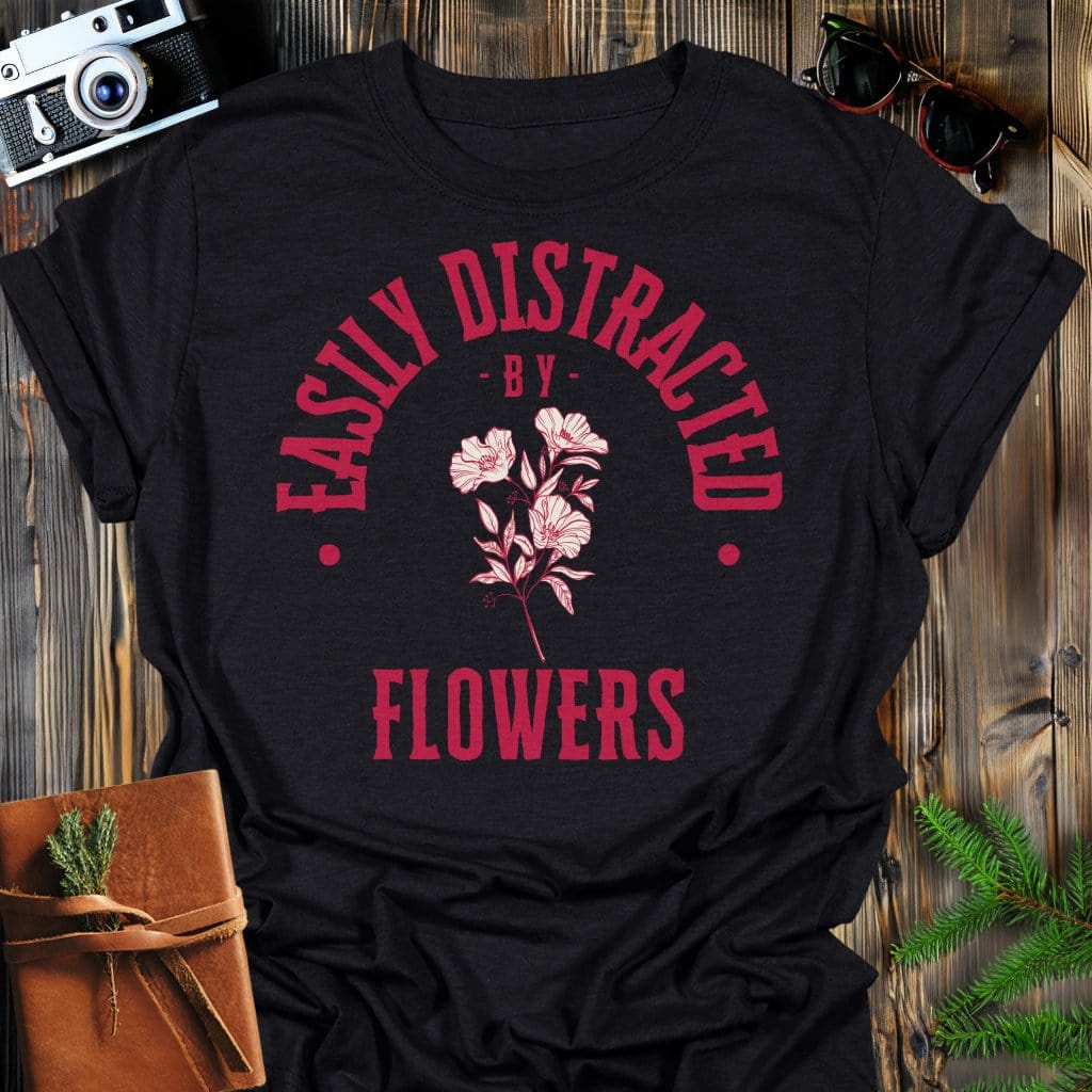 Distracted by Flowers T-Shirt In S / Black Lightweight adventure tee for outdoor lovers Perfect for hiking camping or road trips Made from soft breathable cotton for all-day comfort Ideal for nature lovers and adventurers FAYO Threads outdoor apparel remember Fun Awaits You Outside