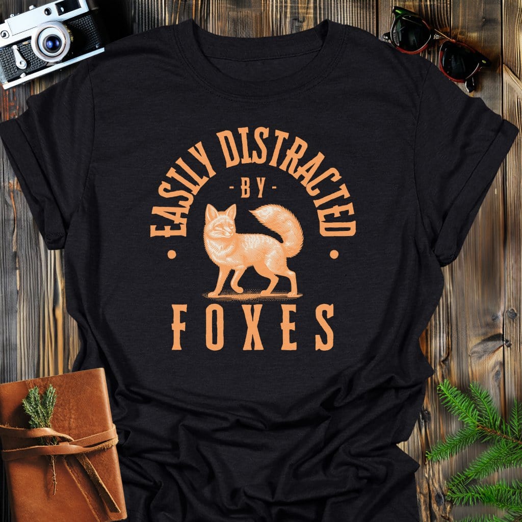 Distracted by Foxes T-Shirt In S / Black Lightweight adventure tee for outdoor lovers Perfect for hiking camping or road trips Made from soft breathable cotton for all-day comfort Ideal for nature lovers and adventurers FAYO Threads outdoor apparel remember Fun Awaits You Outside