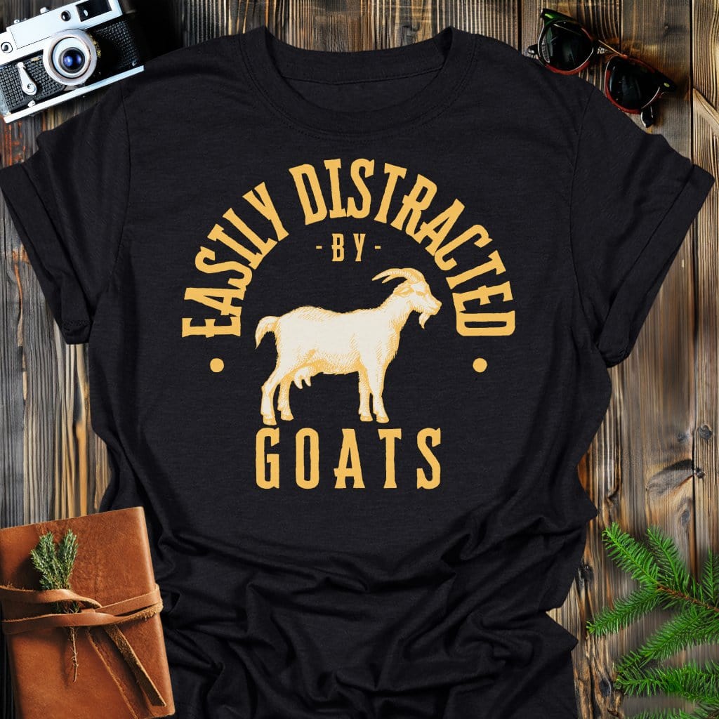 Distracted by Goats T-Shirt In S / Black Lightweight adventure tee for outdoor lovers Perfect for hiking camping or road trips Made from soft breathable cotton for all-day comfort Ideal for nature lovers and adventurers FAYO Threads outdoor apparel remember Fun Awaits You Outside