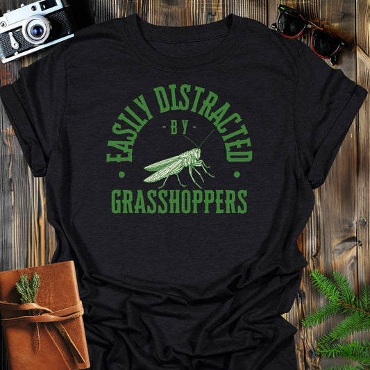 Distracted By Grasshoppers T-Shirt In S / Black Lightweight adventure tee for outdoor lovers Perfect for hiking camping or road trips Made from soft breathable cotton for all-day comfort Ideal for nature lovers and adventurers FAYO Threads outdoor apparel remember Fun Awaits You Outside