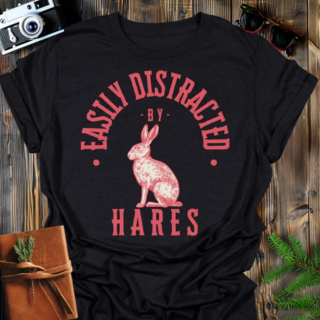 Distracted by Hares T-Shirt In S / Black Lightweight adventure tee for outdoor lovers Perfect for hiking camping or road trips Made from soft breathable cotton for all-day comfort Ideal for nature lovers and adventurers FAYO Threads outdoor apparel remember Fun Awaits You Outside