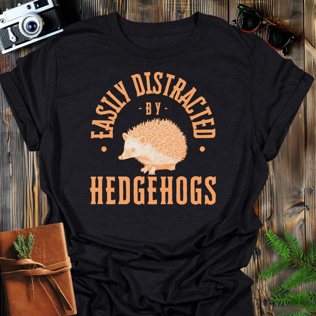 Distracted By Hedgehogs T-Shirt In S / Black Lightweight adventure tee for outdoor lovers Perfect for hiking camping or road trips Made from soft breathable cotton for all-day comfort Ideal for nature lovers and adventurers FAYO Threads outdoor apparel remember Fun Awaits You Outside