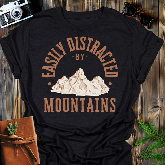 Distracted by Mountains T-Shirt In S / Black Lightweight adventure tee for outdoor lovers Perfect for hiking camping or road trips Made from soft breathable cotton for all-day comfort Ideal for nature lovers and adventurers FAYO Threads outdoor apparel remember Fun Awaits You Outside