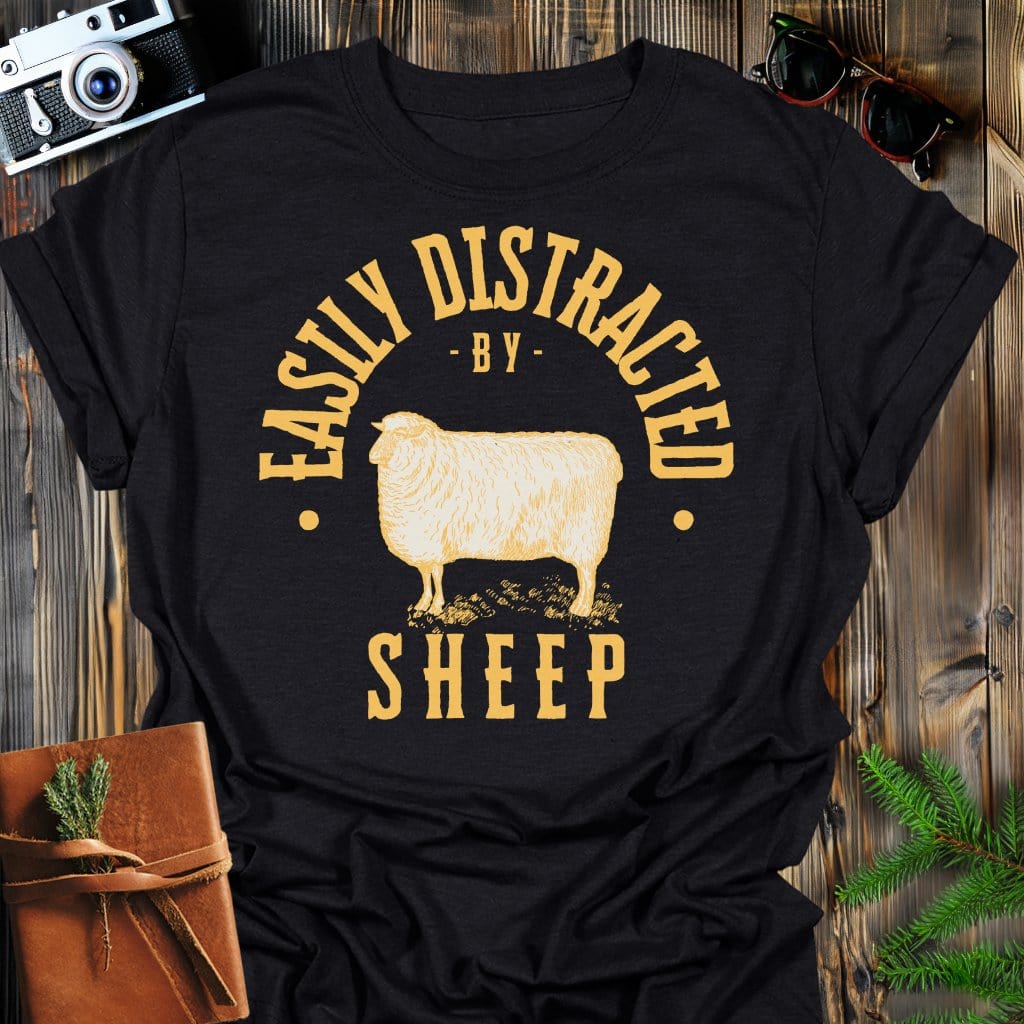 Distracted by Sheep T-Shirt In S / Black Lightweight adventure tee for outdoor lovers Perfect for hiking camping or road trips Made from soft breathable cotton for all-day comfort Ideal for nature lovers and adventurers FAYO Threads outdoor apparel remember Fun Awaits You Outside