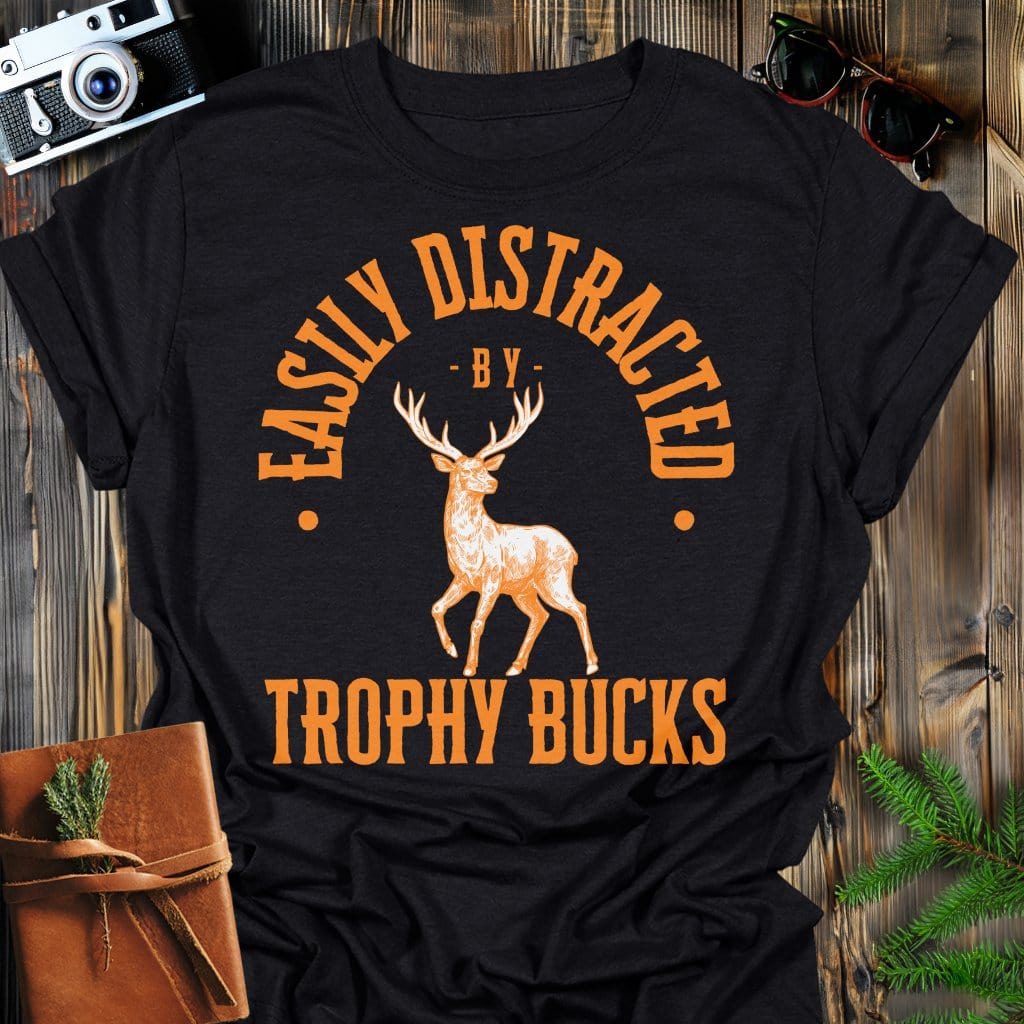 Distracted by Trophy Bucks T-Shirt In S / Black Lightweight adventure tee for outdoor lovers Perfect for hiking camping or road trips Made from soft breathable cotton for all-day comfort Ideal for nature lovers and adventurers FAYO Threads outdoor apparel remember Fun Awaits You Outside