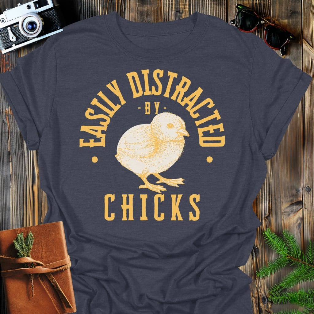 Distracted by Chicks T-Shirt In S / Dark Heather Lightweight adventure tee for outdoor lovers Perfect for hiking camping or road trips Made from soft breathable cotton for all-day comfort Ideal for nature lovers and adventurers FAYO Threads outdoor apparel remember Fun Awaits You Outside