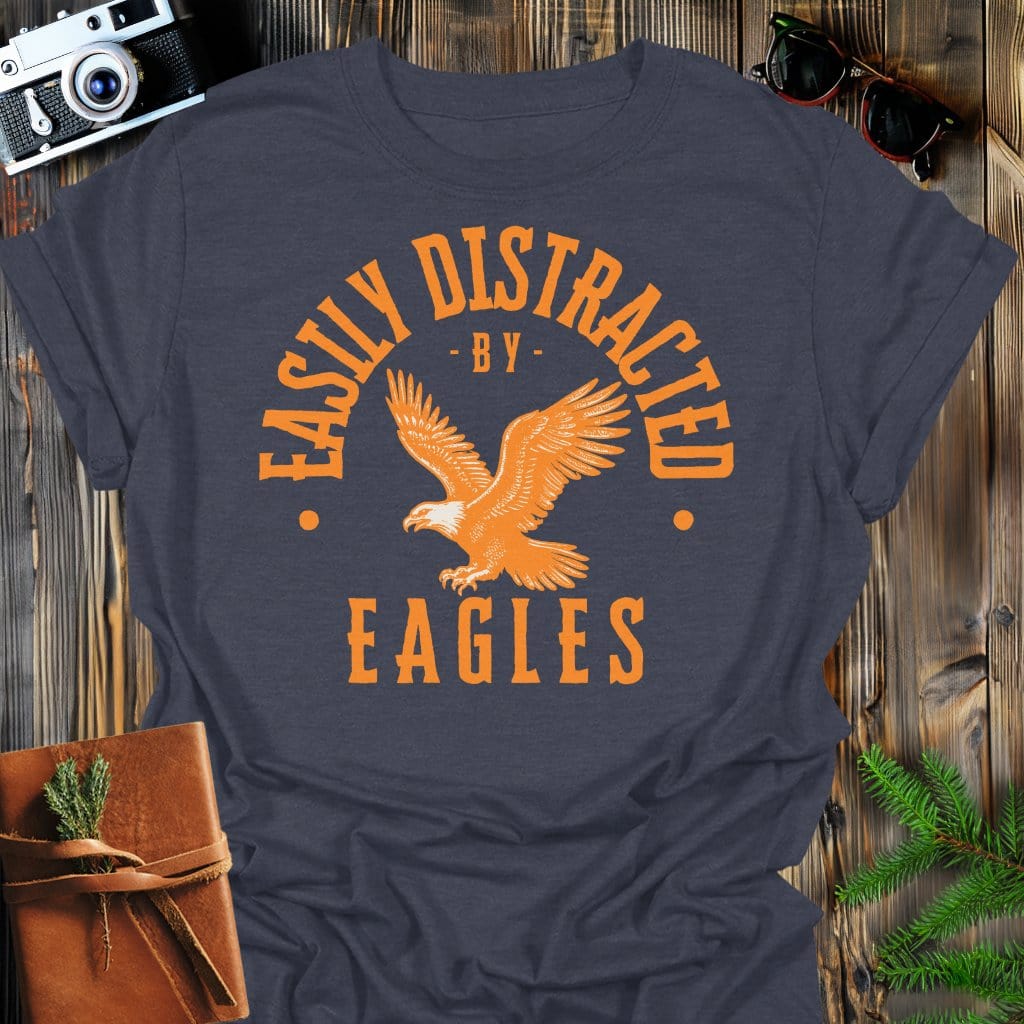 Distracted by Eagles T-Shirt In S / Dark Heather Lightweight adventure tee for outdoor lovers Perfect for hiking camping or road trips Made from soft breathable cotton for all-day comfort Ideal for nature lovers and adventurers FAYO Threads outdoor apparel remember Fun Awaits You Outside