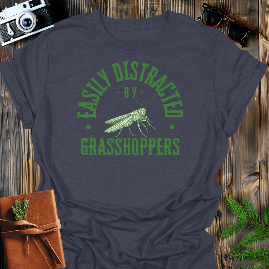 Distracted By Grasshoppers T-Shirt In S / Dark Heather Lightweight adventure tee for outdoor lovers Perfect for hiking camping or road trips Made from soft breathable cotton for all-day comfort Ideal for nature lovers and adventurers FAYO Threads outdoor apparel remember Fun Awaits You Outside