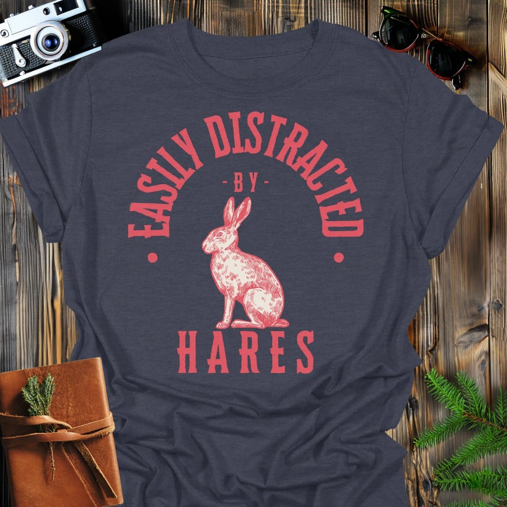 Distracted by Hares T-Shirt In S / Dark Heather Lightweight adventure tee for outdoor lovers Perfect for hiking camping or road trips Made from soft breathable cotton for all-day comfort Ideal for nature lovers and adventurers FAYO Threads outdoor apparel remember Fun Awaits You Outside