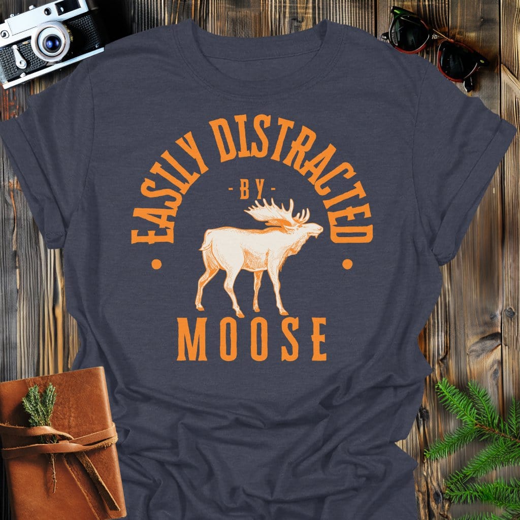 Distracted by Moose T-Shirt In S / Dark Heather Lightweight adventure tee for outdoor lovers Perfect for hiking camping or road trips Made from soft breathable cotton for all-day comfort Ideal for nature lovers and adventurers FAYO Threads outdoor apparel remember Fun Awaits You Outside