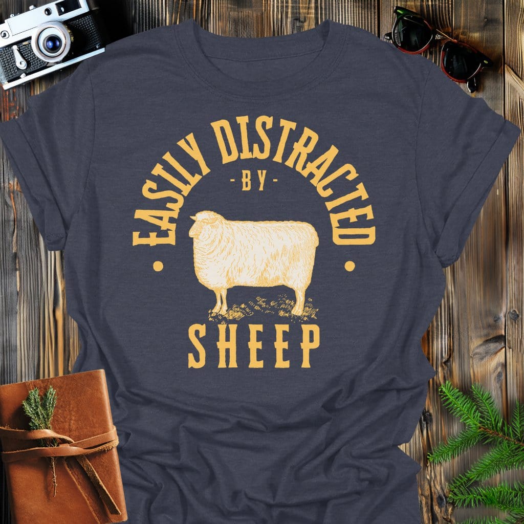 Distracted by Sheep T-Shirt In S / Dark Heather Lightweight adventure tee for outdoor lovers Perfect for hiking camping or road trips Made from soft breathable cotton for all-day comfort Ideal for nature lovers and adventurers FAYO Threads outdoor apparel remember Fun Awaits You Outside