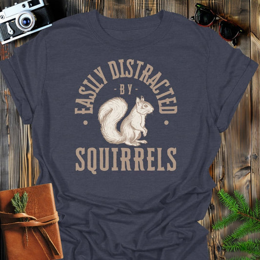 Distracted By Squirrels T-Shirt In S / Dark Heather Lightweight adventure tee for outdoor lovers Perfect for hiking camping or road trips Made from soft breathable cotton for all-day comfort Ideal for nature lovers and adventurers FAYO Threads outdoor apparel remember Fun Awaits You Outside