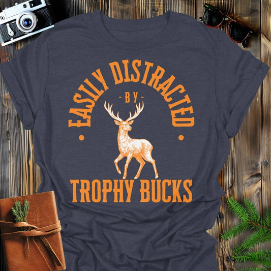 Distracted by Trophy Bucks T-Shirt In S / Dark Heather Lightweight adventure tee for outdoor lovers Perfect for hiking camping or road trips Made from soft breathable cotton for all-day comfort Ideal for nature lovers and adventurers FAYO Threads outdoor apparel remember Fun Awaits You Outside