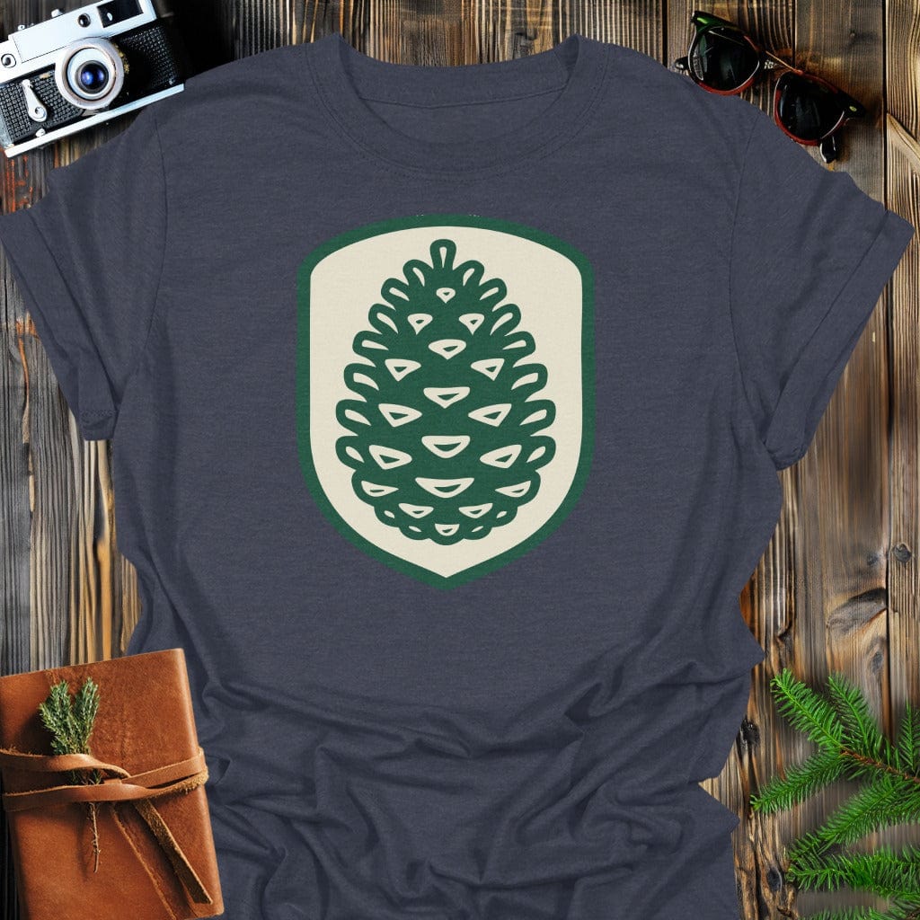 Pinecone Badge T-Shirt In S / Dark Heather Lightweight adventure tee for outdoor lovers Perfect for hiking camping or road trips Made from soft breathable cotton for all-day comfort Ideal for nature lovers and adventurers FAYO Threads outdoor apparel remember Fun Awaits You Outside
