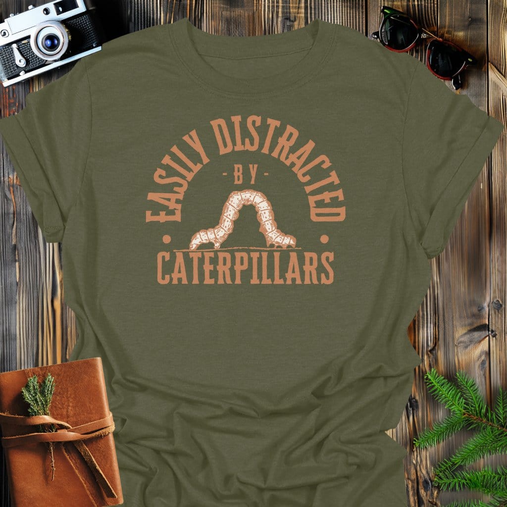 Distracted By Catepillars T-Shirt In S / Military Green Lightweight adventure tee for outdoor lovers Perfect for hiking camping or road trips Made from soft breathable cotton for all-day comfort Ideal for nature lovers and adventurers FAYO Threads outdoor apparel remember Fun Awaits You Outside
