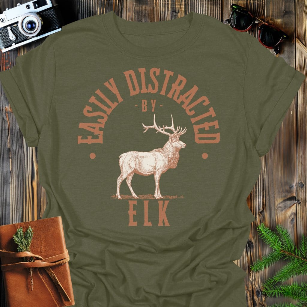 Distracted by Elk T-Shirt In S / Military Green Lightweight adventure tee for outdoor lovers Perfect for hiking camping or road trips Made from soft breathable cotton for all-day comfort Ideal for nature lovers and adventurers FAYO Threads outdoor apparel remember Fun Awaits You Outside