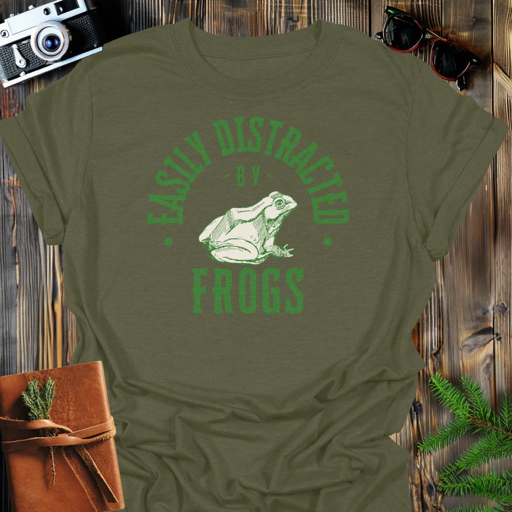 Distracted By Frogs T-Shirt In S / Military Green Lightweight adventure tee for outdoor lovers Perfect for hiking camping or road trips Made from soft breathable cotton for all-day comfort Ideal for nature lovers and adventurers FAYO Threads outdoor apparel remember Fun Awaits You Outside
