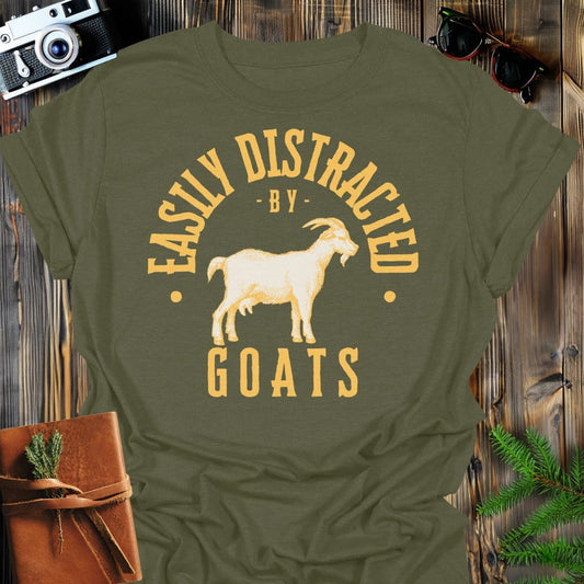 Distracted by Goats T-Shirt In S / Military Green Lightweight adventure tee for outdoor lovers Perfect for hiking camping or road trips Made from soft breathable cotton for all-day comfort Ideal for nature lovers and adventurers FAYO Threads outdoor apparel remember Fun Awaits You Outside
