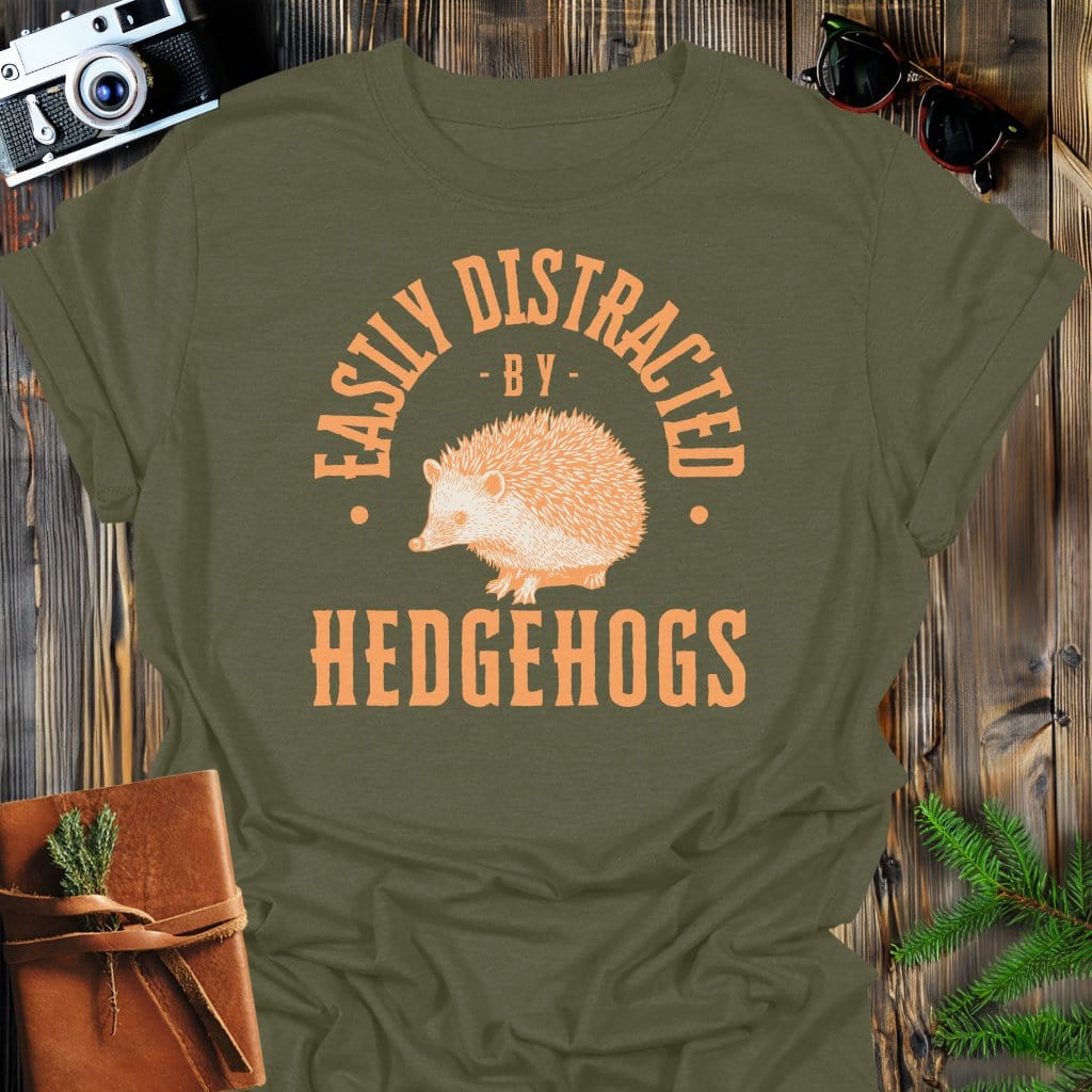Distracted By Hedgehogs T-Shirt In S / Military Green Lightweight adventure tee for outdoor lovers Perfect for hiking camping or road trips Made from soft breathable cotton for all-day comfort Ideal for nature lovers and adventurers FAYO Threads outdoor apparel remember Fun Awaits You Outside
