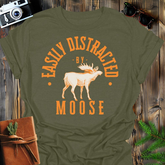 Distracted by Moose T-Shirt In S / Military Green Lightweight adventure tee for outdoor lovers Perfect for hiking camping or road trips Made from soft breathable cotton for all-day comfort Ideal for nature lovers and adventurers FAYO Threads outdoor apparel remember Fun Awaits You Outside