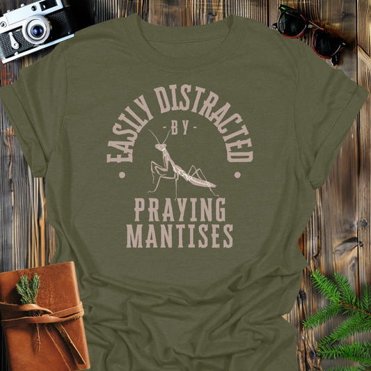 Distracted By Praying Matises T-Shirt In S / Military Green Lightweight adventure tee for outdoor lovers Perfect for hiking camping or road trips Made from soft breathable cotton for all-day comfort Ideal for nature lovers and adventurers FAYO Threads outdoor apparel remember Fun Awaits You Outside